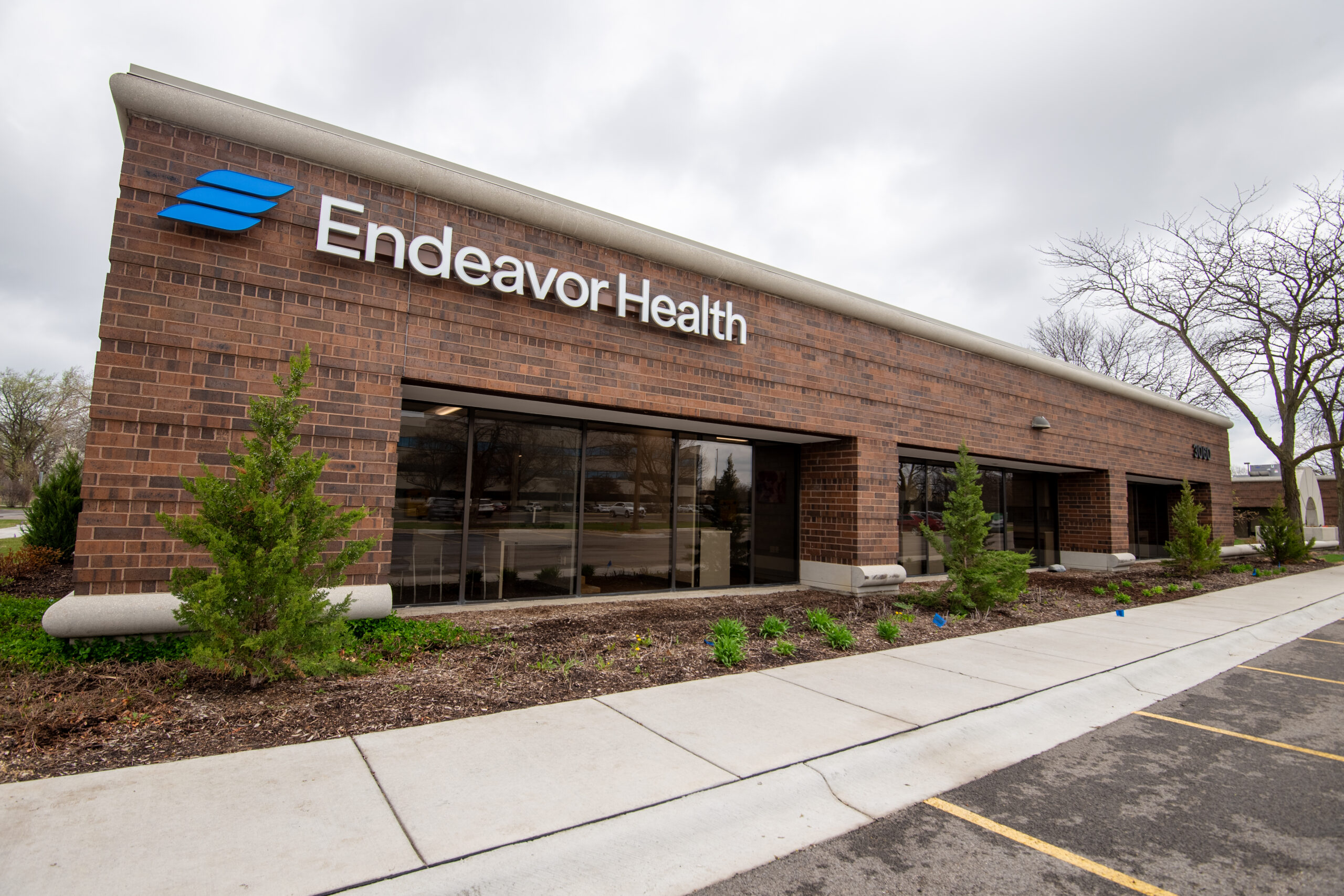 Exterior view of a healthcare facility with storefront glass and All Pro Glazing Systems work.
